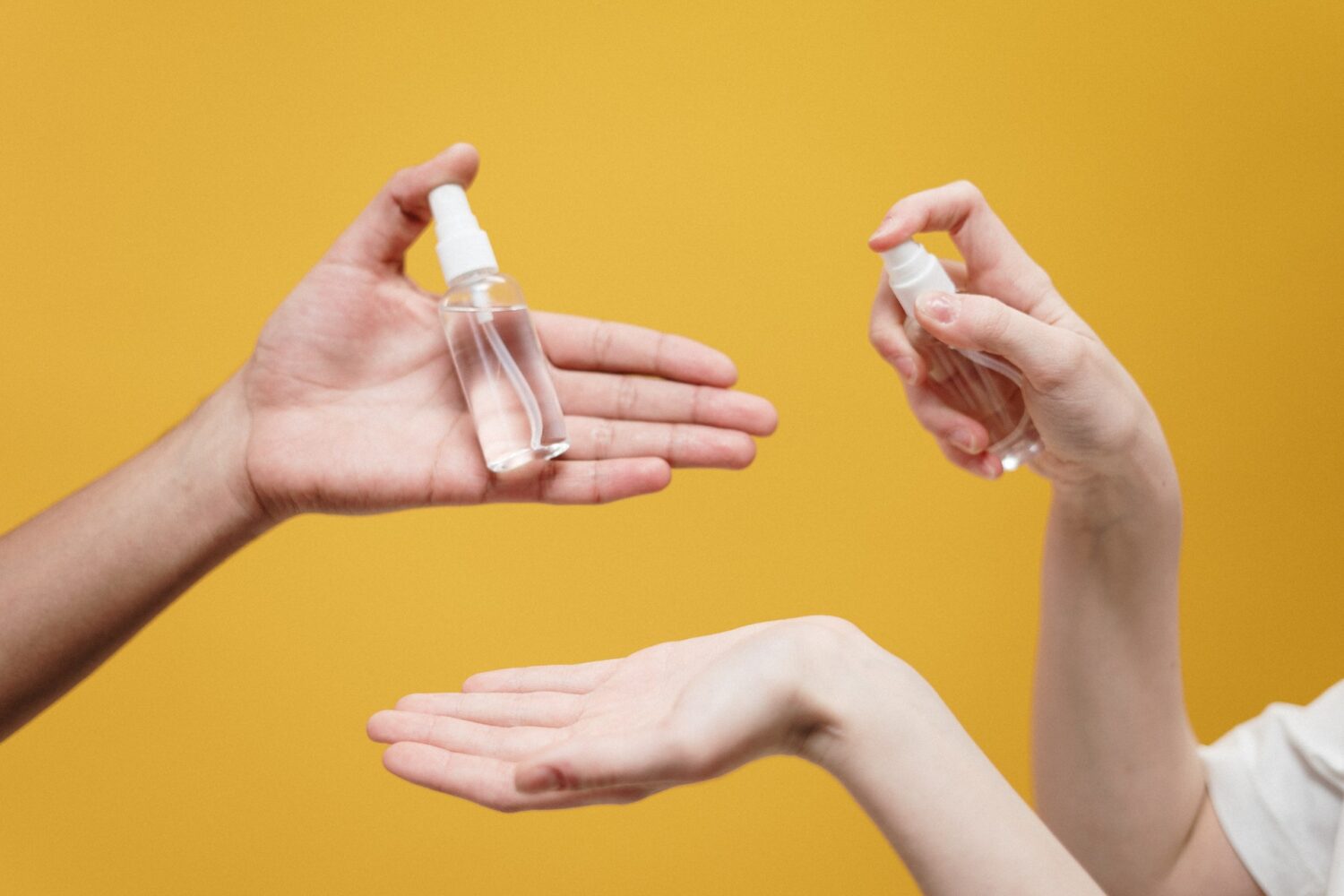 people-holding-clear-glass-bottle-3951862-e1595494469522