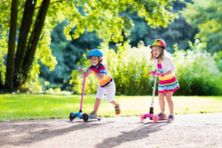 depositphotos_148508765-stock-photo-kids-riding-scooter-in-summer