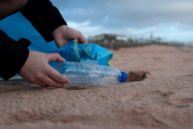 person-holding-clear-plastic-bottle-3480494-scaled