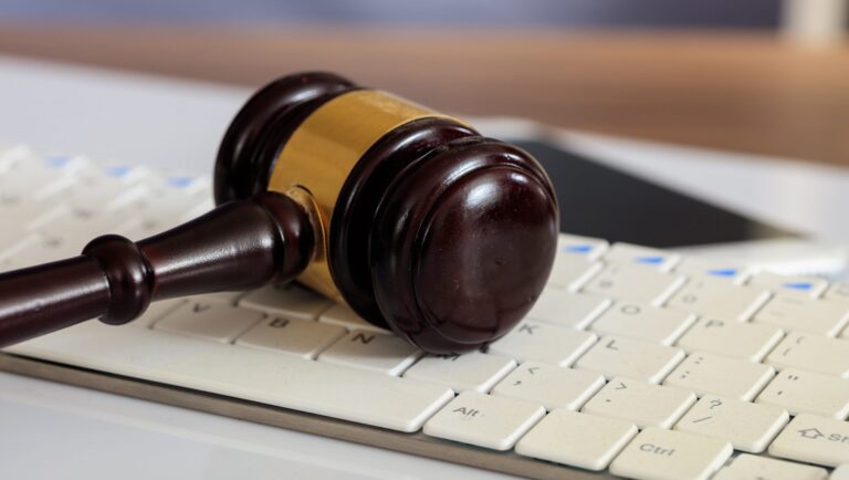 auction-or-judge-gavel-on-a-computer-keyboard-PSKDWVP-min-scaled