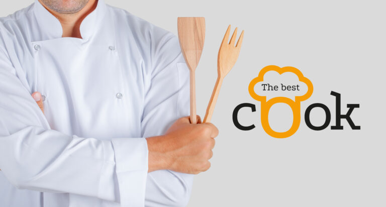 Male chef holding kitchen utensils with crossed arms in uniform