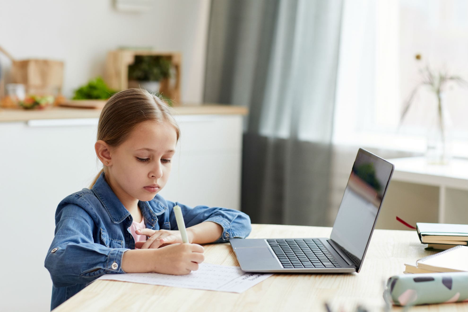 cute-schoolgirl-studying-at-home-TMDNDSY-min