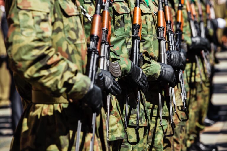 military-force-uniform-soldiers-standing-in-a-row-FTQSNGM-min-scaled