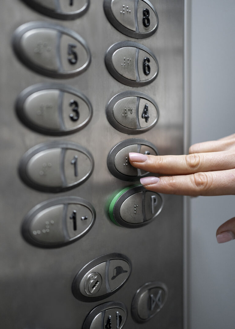 blind-person-choosing-floor-in-elevator