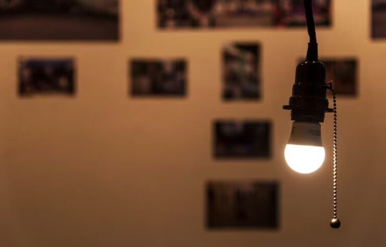 a-bright-light-bulb-hanging-in-a-room_53876-148163