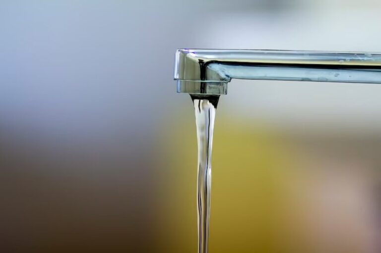 close-up-of-faucet-with-turned-drop-water-in-modern-bathroom-horizontal-crop-with-shallow-depth-of-field_127089-1538