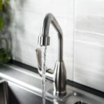 New and  modern steel faucet in the kitchen
