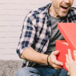 joyful-man-receiving-present_23-2147723773