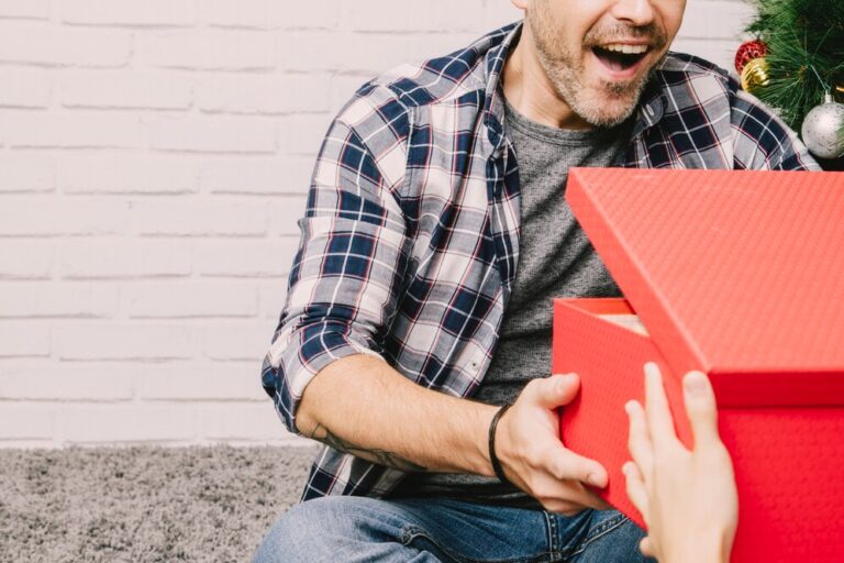 joyful-man-receiving-present_23-2147723773