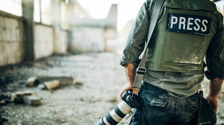 Man war journalist with camera