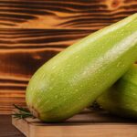 Marrows,Or,Zucchinis,On,A,Cutting,Board,With,Rosemary,Leaves