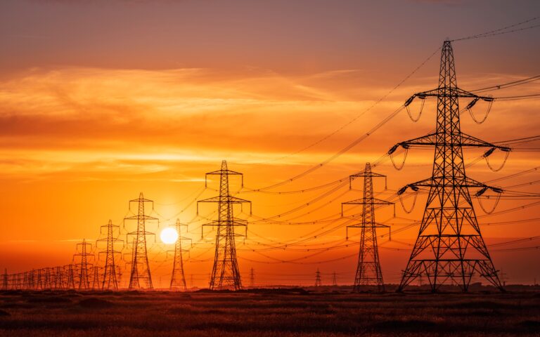 Sun,Setting,Behind,The,Electric,Power,Lines,Running,From,Dungeness